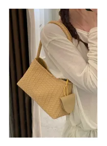 Woven shoulder bag detail view, soft leather intrecciato style underarm bag, elegant daily carry.