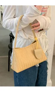Detailed view of the stylish beige woven shoulder bag, elegant underarm daily handbag.