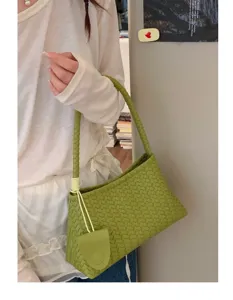 Stylish woven leather underarm shoulder bag for women, chic commuter handbag and purse.