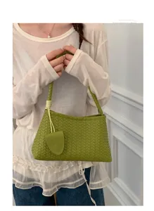 Green woven shoulder bag for women, stylish leather underarm commuting handbag with handle.