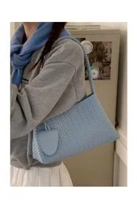 Light blue woven shoulder bag for women, chic PU leather underarm handbag for daily commute.