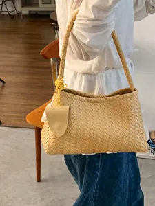 Woven leather underarm shoulder bag for women, stylish vintage commuting handbag.