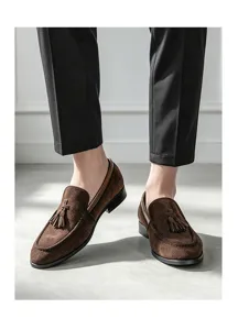 Men's brown suede tassel loafers casual slip-on dress shoes detail view for fashion outfit.