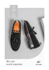 Black suede tassel loafer detail showcasing premium texture, shoe tree, and outsole design.