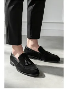 Detailed view of men black suede tassel loafers, slip-on comfort design, premium texture