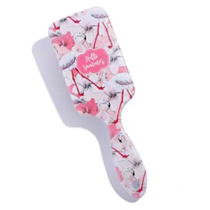 Brosse a cheveux plate imprimee flamant rose avec coussin d air pour le coiffage quotidien.