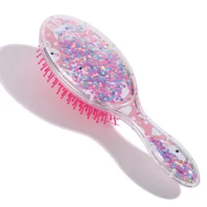 Belle brosse à cheveux à paillettes liquides avec coussin d'air et étoiles roses scintillantes.