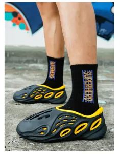 Men's summer casual hollow beach shoes, breathable black yellow foam clogs for outdoor wear.