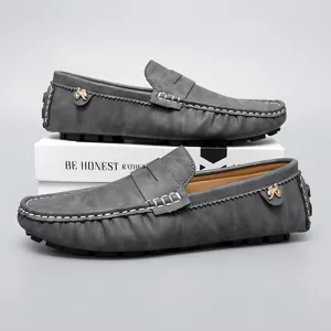 Grey leather casual mens loafers drivers shoes detail with white stitching and new style.