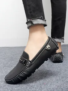 Men's black leather driving shoes casual slip-on loafers detail view with white stitching.