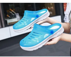Detail view of stylish blue couple clogs, lightweight hollow design, breathable beach sandals.
