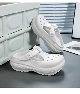 Detail shot of white chunky platform Mary Jane sandals with breathable holes and buckle strap.