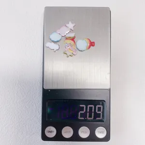 Resin sea animal and candy cabochons for DIY nail art and phone case decoration. Detail.