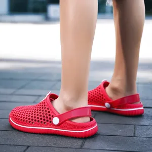 Comfortable red children clogs for summer outdoor beach wear, breathable hollow design kids shoes.