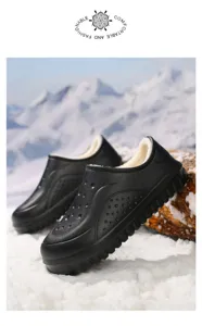 Detail shot of black fleece-lined winter clogs with thick anti-slip sole on snowy background.
