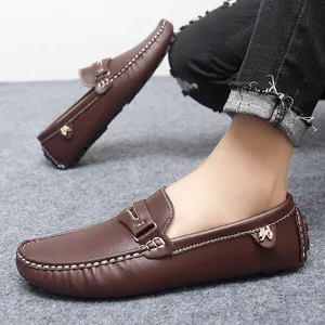 Comfortable men's brown leather driving shoes, classic slip-on loafers with metal decor.