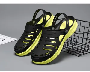Detail view of black and yellow thick-soled EVA garden clogs for summer outdoor wear.