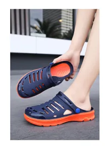 Close-up of trendy dual-color EVA garden clogs with thick soles and breathable ventilation holes.