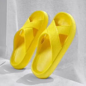 Yellow cross-strap thick-soled soft slide slippers for women, comfortable bathroom footwear.