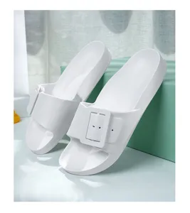 Comfortable white flat slide sandals with chunky square buckle for casual summer outdoor use.