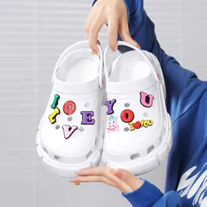 Thick bottom platform clogs for women, white summer garden shoes with cute letter charms.