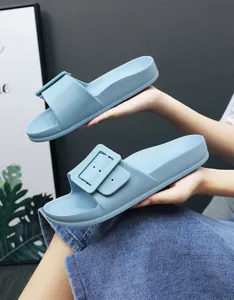 Unisex light blue slip-on comfort slippers with elegant buckle detail for summer casual wear.