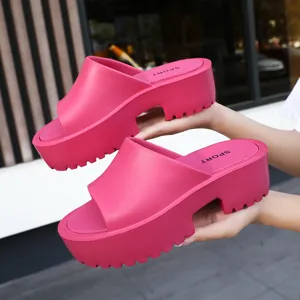 Stylish pink chunky platform slide sandals for women, perfect for summer outdoor wear.