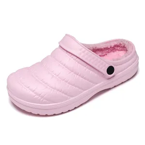 Comfortable pink winter plush lined clogs for women, warm casual indoor slip-on shoes.