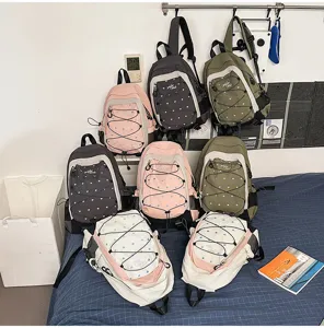 Casual sweet cool style multi-color backpack with heart pattern and bungee cords.