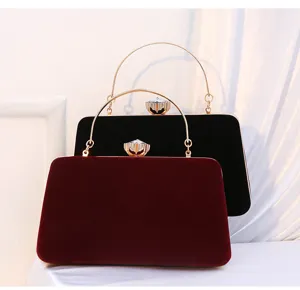 Velvet evening clutch bag with metal handle and diamond clasp for party and wedding dress.