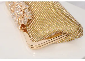 Exquisite rhinestone evening clutch bag with sparkling crystal details and metallic frame.