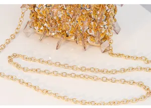 Exquisite beaded evening bag detail showing sparkling crystals and gold chain strap craftsmanship.