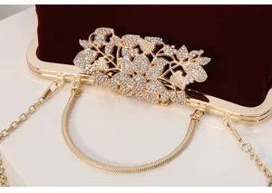 Wine red velvet evening clutch bag detail, gold metal frame, rhinestone crystal flower clasp.