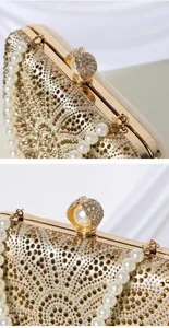 Detailed view of luxury rhinestone evening clutch bag with pearl chain and flower clasp.