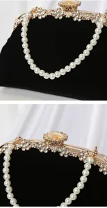 Exquisite black velvet evening clutch bag with pearl handle and rhinestone details detail view.