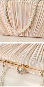 Exquisite pleated evening clutch detail showing satin texture, pearl handle and gold clasp.