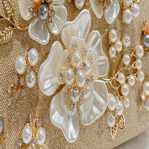 Exquisite pearl and crystal evening bag detail, featuring gorgeous floral embellishments.