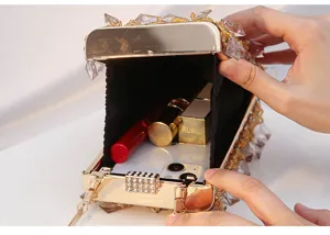 Detail view of crystal beaded evening clutch bag, showing interior capacity and clasp.