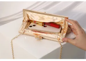 Rhinestone evening clutch bag interior detail, featuring a metallic frame and sparkly crystals.