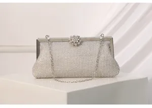 Sparkling rhinestone evening clutch bag with metal frame and chain for women banquet wedding.