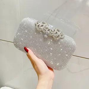 Exquisite rhinestone evening clutch bag with sparkling crystals, perfect for parties and events.