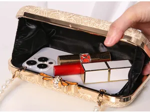 Detailed view of gold lace evening clutch bag with pearl strap, showing spacious interior capacity.