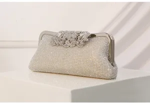 Detailed view of the sparkling rhinestone evening clutch with elegant floral clasp design.