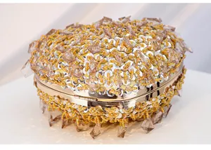 Exquisite heart-shaped crystal beaded evening bag detail, sparkling luxury clutch handbag showcase.