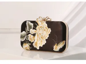 Elegant black satin evening clutch featuring exquisite peony and butterfly embroidery.
