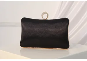 Black satin evening clutch bag detail, elegant crystal ring handle for women banquet.