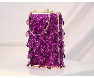 Detail view of purple sequin beaded evening bag, shimmering crystal fringe, gold frame.