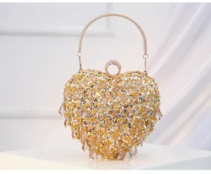 Exquisite heart-shaped evening clutch with sequin embroidery, crystal beads and ring handle.