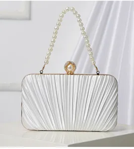 White pleated evening clutch bag with elegant pearl handle and sparkling rhinestone clasp.