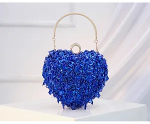 Blue heart-shaped beaded evening clutch bag with gold handle for banquet party dress.
